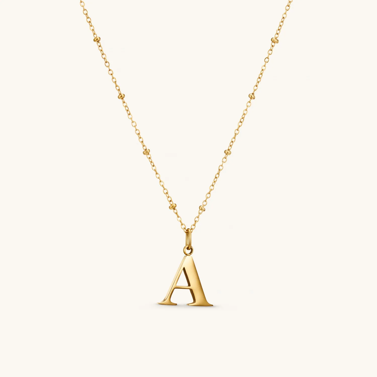 A Initial Pendant Necklace In Gold