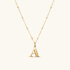 A Initial Pendant Necklace In Gold